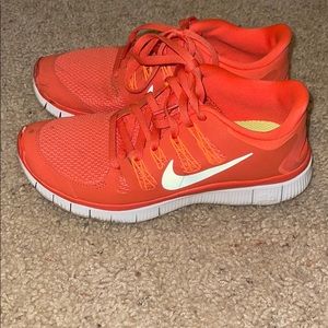 Orange Nike free run sneakers